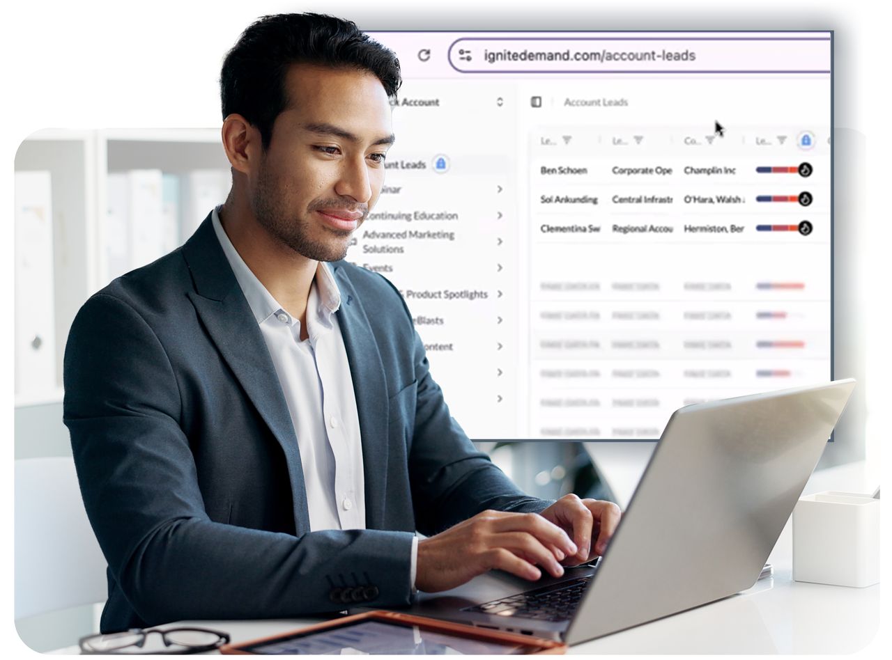 Sales professional typing on a laptop while reviewing scored leads in IgniteDemand Accelerate